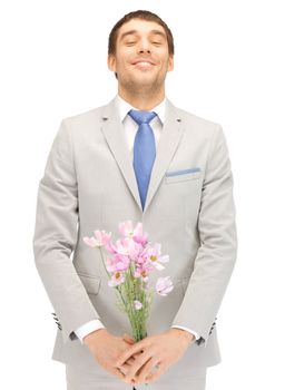 picture of handsome man with flowers in hand