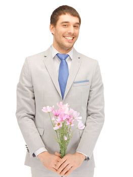 picture of handsome man with flowers in hand