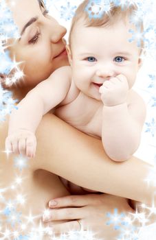 picture of happy mother with baby and snowflakes