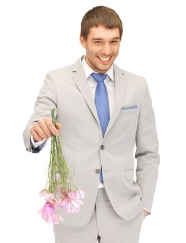 picture of handsome man with flowers in hand