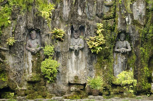 traditional statues in bali indonesia garden