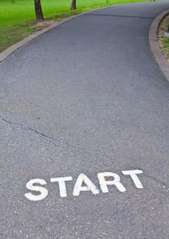 Start sign on walkway road in the park