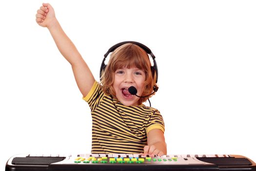 little girl play keyboard and sing