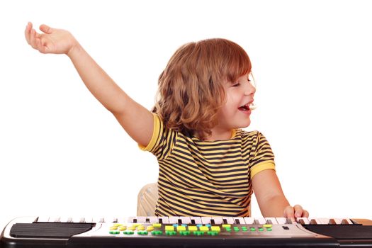 little girl play music on keyboard