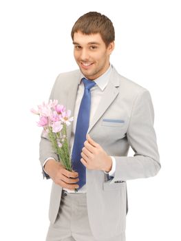 picture of handsome man with flowers in hand