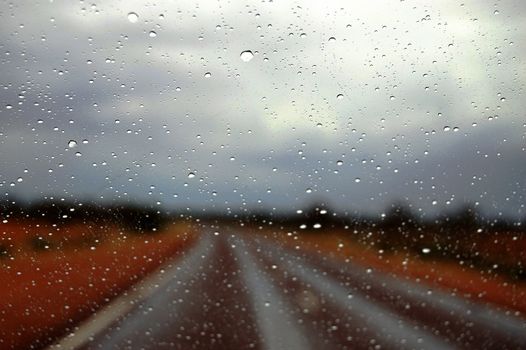 Rain on the road highway somewhere in outback, South Australia