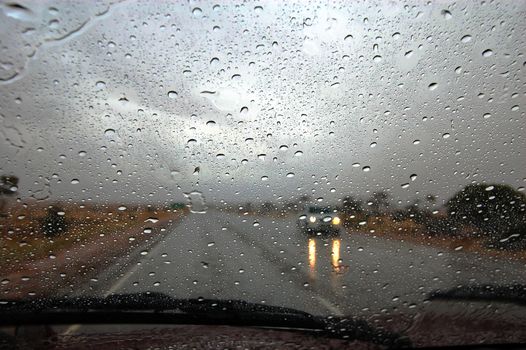 Rain on the road highway somewhere in outback, South Australia