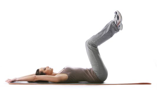 Fitness woman doing fitness exercise on mat . White background