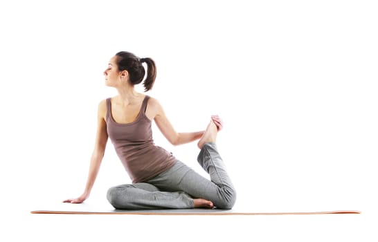 Fitness woman doing fitness exercise on mat . White background