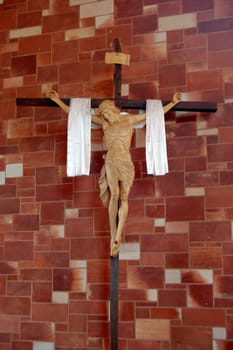 Statue of Jesus Christ on a cross in church, Alice Springs, Australia