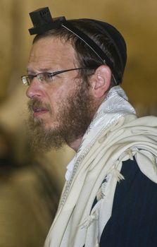 JERUSALEM - SEP 26 : Jewish man prays during the penitential prayers the "Selichot" , held on September 26 2011 in the "Wailing wall"  in  Jerusalem , Israel 