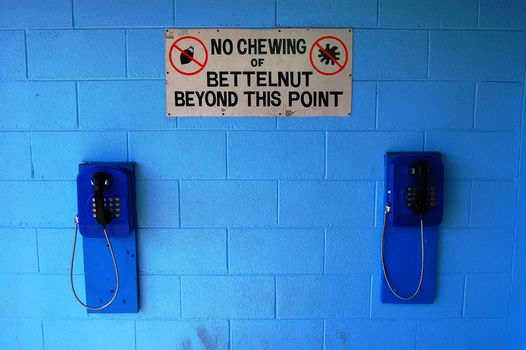 Sign and telephones in Port Moresby, Papua New Guinea