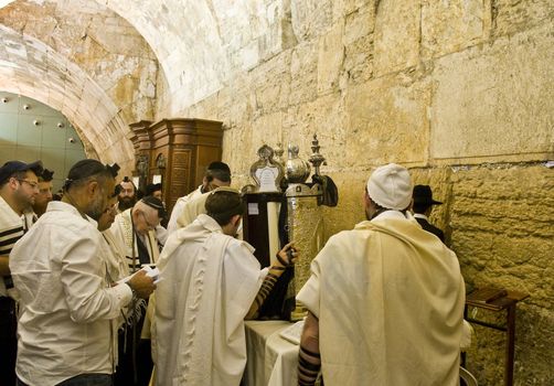 JERUSALEM - SEP 26 : Jewish old man prays during the penitential prayers the "Selichot" , held on September 26 2011 in the "Wailing wall"  in  Jerusalem , Israel 