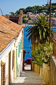 Colorful narrow street in Mali Losinj, Dalmatia, Croatia