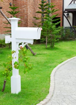 white wood mail box in the garden