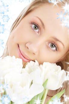 picture of happy blonde with white tulips and snowflakes