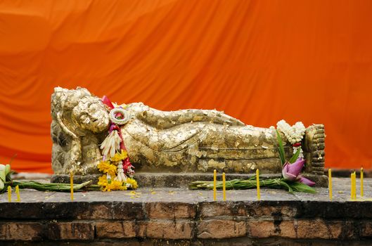 reclining buddha statue with gold leaf in thailand