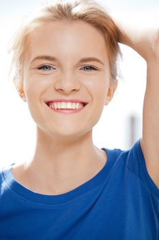 picture of happy and smiling teenage girl outdoors