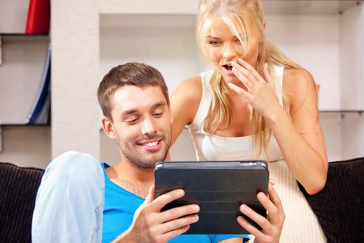 picture of happy couple with tablet pc computer