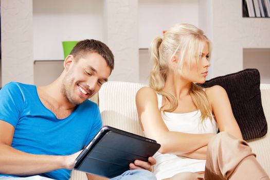 bright picture of couple with tablet PC (focus on man)