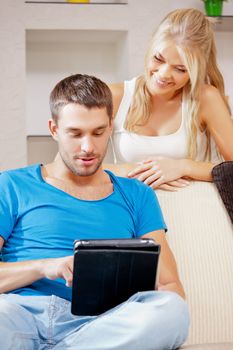 bright picture of happy couple with tablet PC