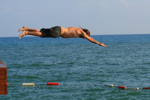 Man jumping into the sea