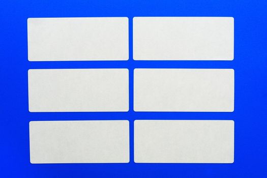 White cards on blue background