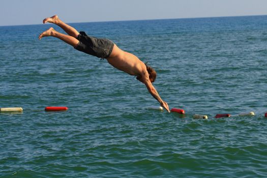 Man jumping into the sea