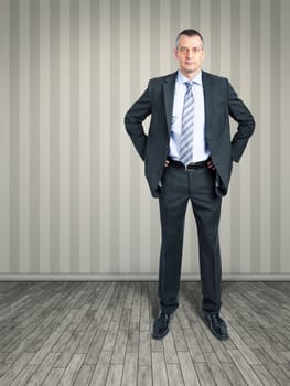 An image of a business man standing in the empty room