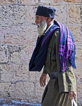 Ethiopian priest walking near the Westren wall in Jerusalem