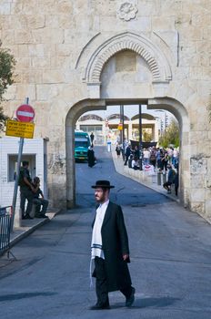 JERUSALEM - OCTOBER 06 2011 : An ultra- Orthodox Jewish man stand near the Dung gate in the old city of Jerusalem , Israel