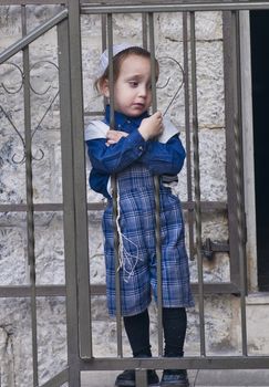 JERUSALEM - OCTOBER 10 2011 : Jewish ultra orthodox child in the " Mea Shearim" neighborhood in Jerusalem Israel.