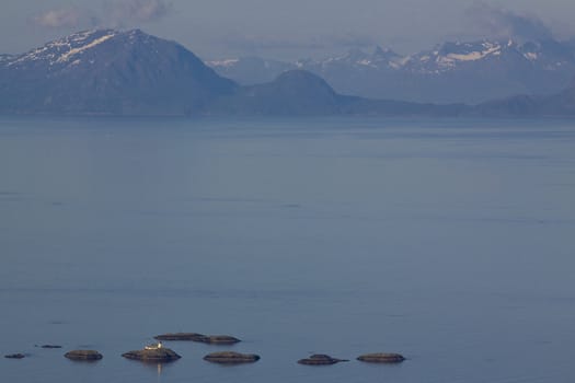 Aerial view of Norwegian sea between Lofoften islands and norwegian mainland dotted with tiny rocky islets