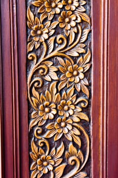 wood carving of flower and leaves