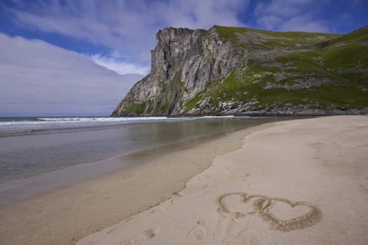 Symbols of love on sandy beach on Lofoten islands in Norway