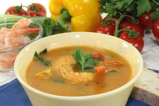 a bowl of bouillabaisse with shrimp and mussels