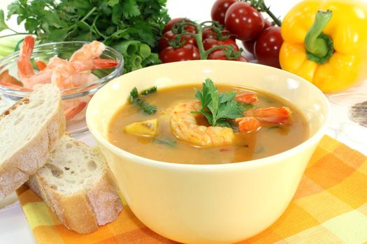 a bowl of bouillabaisse with shrimp and mussels