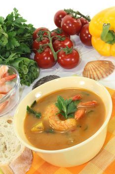 a bowl of bouillabaisse with shrimp and mussels
