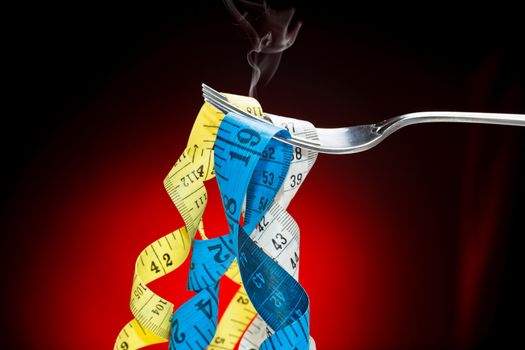 Tape measure pretending to fetuccini in a fork