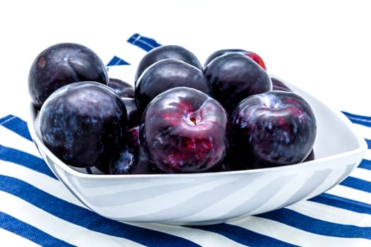 A plums dish on a white background