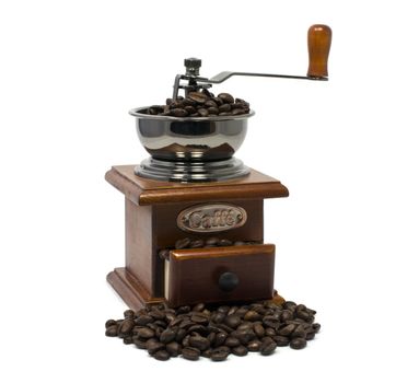 old coffee grinder with beans isolated on white