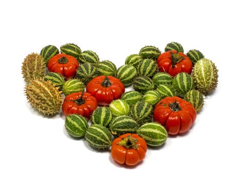 love decoration fruit in red and green isolated on white