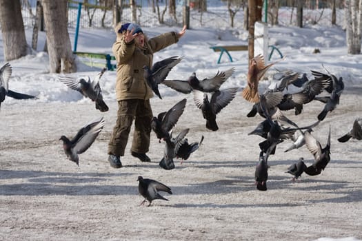 boy in the game mimics the pigeons