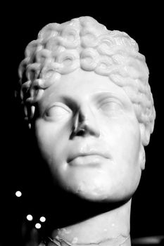 Lisbon, Portugal - May 24, 2018: Face of roman woman carved in marble in the archeological Museum of Lisbon, Portugal