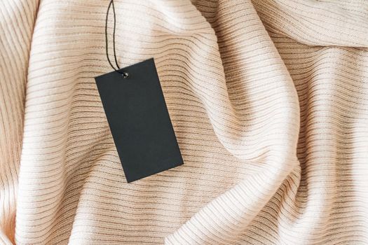 Cosy fabric and clothing tag as organic material background, sustainable fashion and brand label concept.