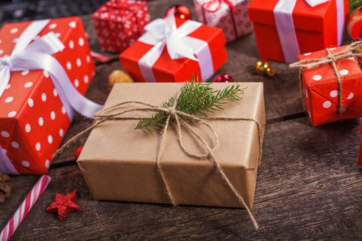 Gift box in wrapping paper with satin ribbon. Merry Christmas holiday concept.