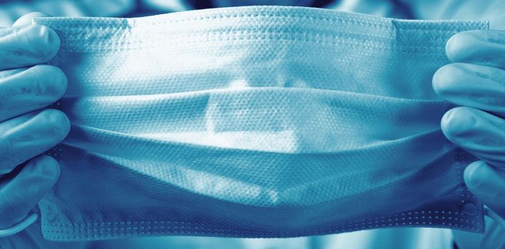 Typical surgical mask to cover mouth, nose. Protection concept, against coronavirus.