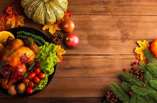 Thanksgiving roast turkey or chicken and vegetables, Top view Christmas dinner feast food decoration traditional homemade on wooden table background, Happy thanksgiving day of holiday concept