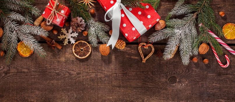 Gift box in wrapping paper with satin ribbon. Merry Christmas holiday concept.