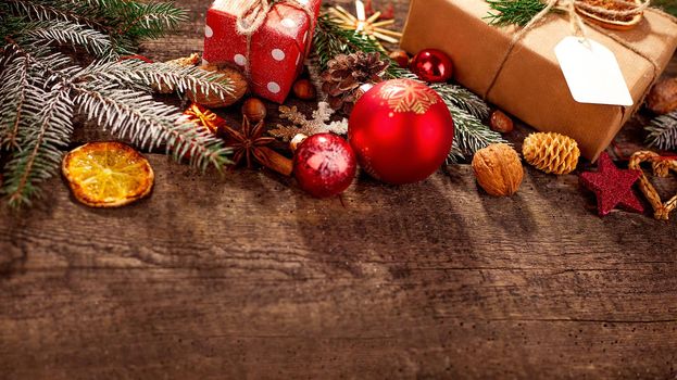 Gift box in wrapping paper with satin ribbon. Merry Christmas holiday concept.